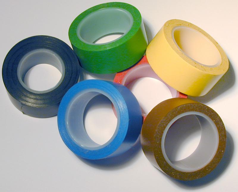 Free Stock Photo: Pile of assorted rolls of electrical insulation tape in different colors over a white background viewed from above