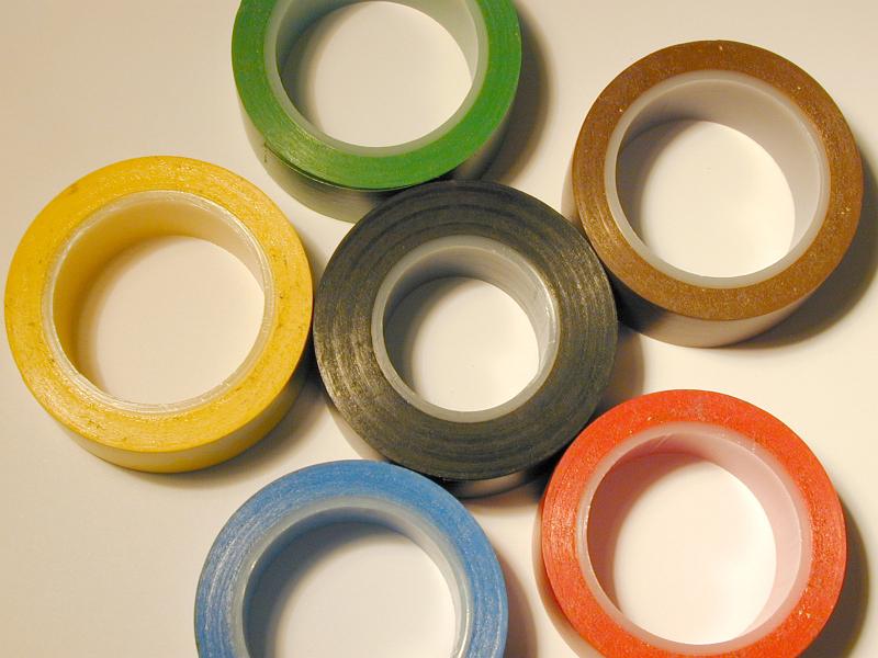 Free Stock Photo: Set of various colorful insulating tapes arranged as a flower, viewed in close-up