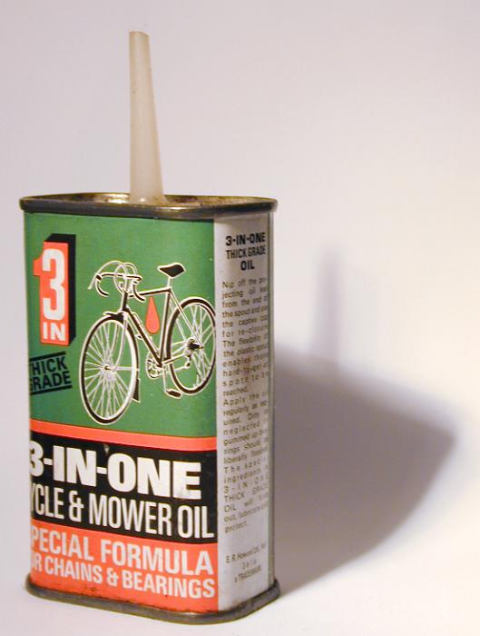 Free Stock Photo: Tin of 3-in-one lubricating motor oil for chains and bearings on a white background with shadow
