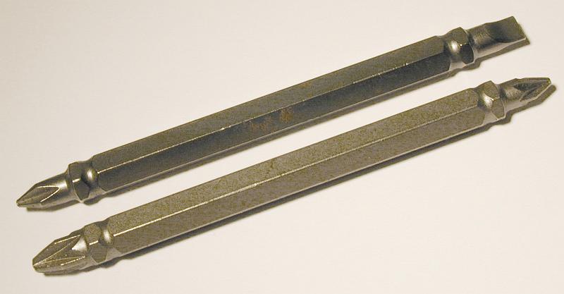 Free Stock Photo: Two different long two-sided bits for electric screwdriver viewed diagonally on white background