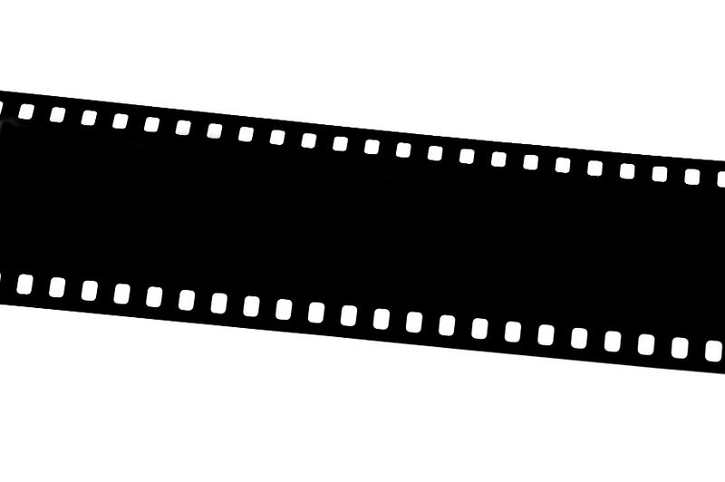 Free Stock Photo: Tightly cropped close up of all black exposed 35 mm film strip over white background