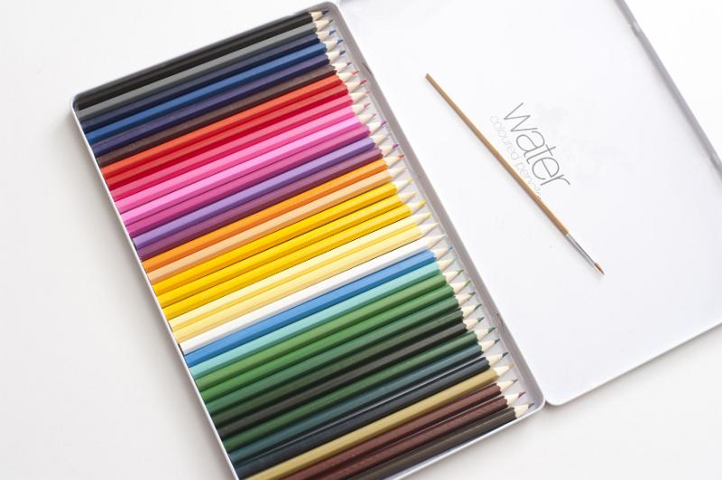 Free Stock Photo: Single set of newly sharpened colored pencils with single paintbrush in top of open lid