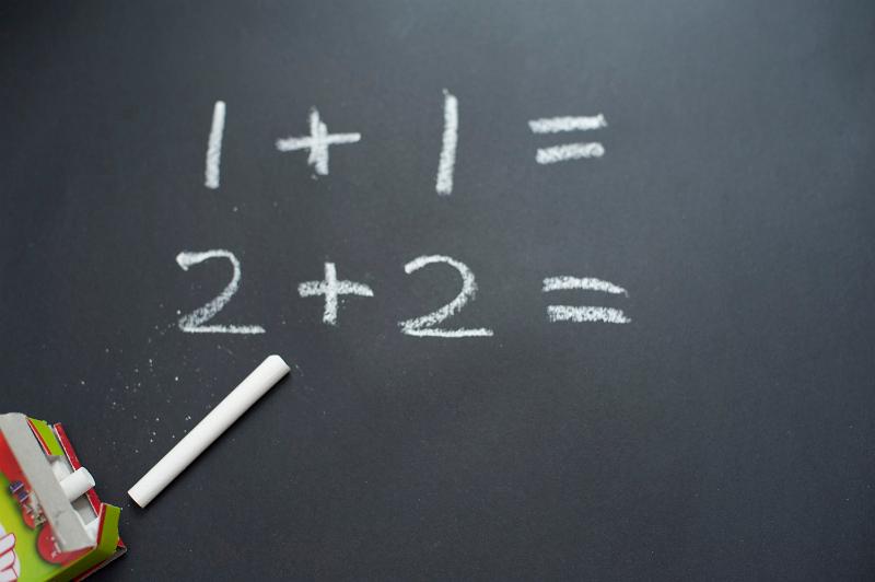 Free Stock Photo: Two addition sums on blackboard explained by Math teacher.