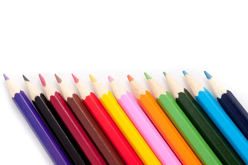 Free Stock Photo: Closeup of a neat row of colouring pencils in a row, over white background with space for text