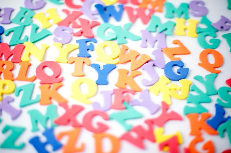 Free Stock Photo: Close up shot of random colorful letters on white background