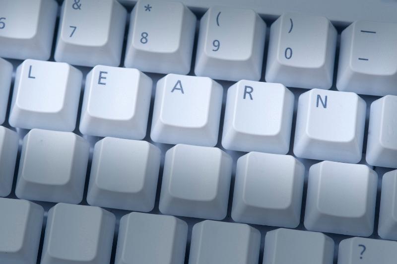 Free Stock Photo: Online education concept with an overhead view of a computer keyboard with all keys blanked out except for the word LEARN