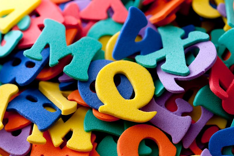 Free Stock Photo: Closeup background of a collection of multicoloured plastic uppercase letters in a shooling, teaching, learning and education concept