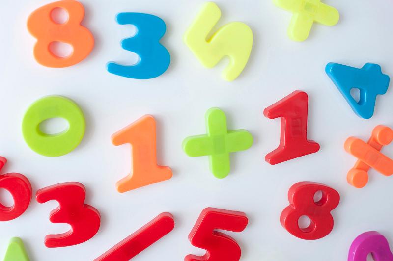 Free Stock Photo: Fridge magnet numbers and mathematical symbols, in bright colours over white background