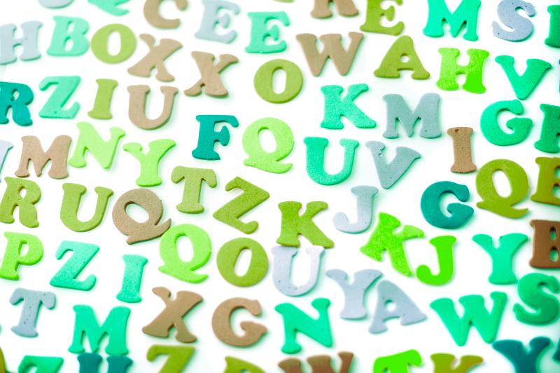 Free Stock Photo: Random array of vowels and consonants scattered on a white surface for teaching young kindergarten children to read, write and spell