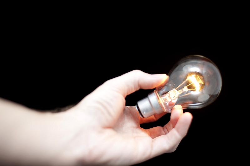 Free Stock Photo: concept image, a hand holding a glowing light bulb