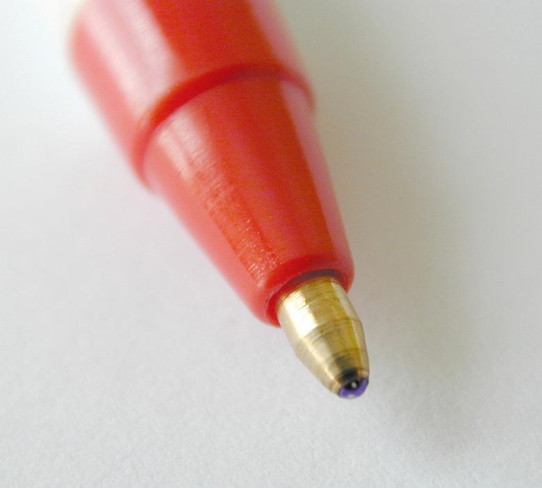 Free Stock Photo: Extreme close up of roller ball pen tip with metal end and a red colored body