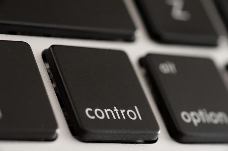 Download image of Black computer control button or key Free Stock Photo: Black computer control button or key on a keyboard viewed obliquely close up
