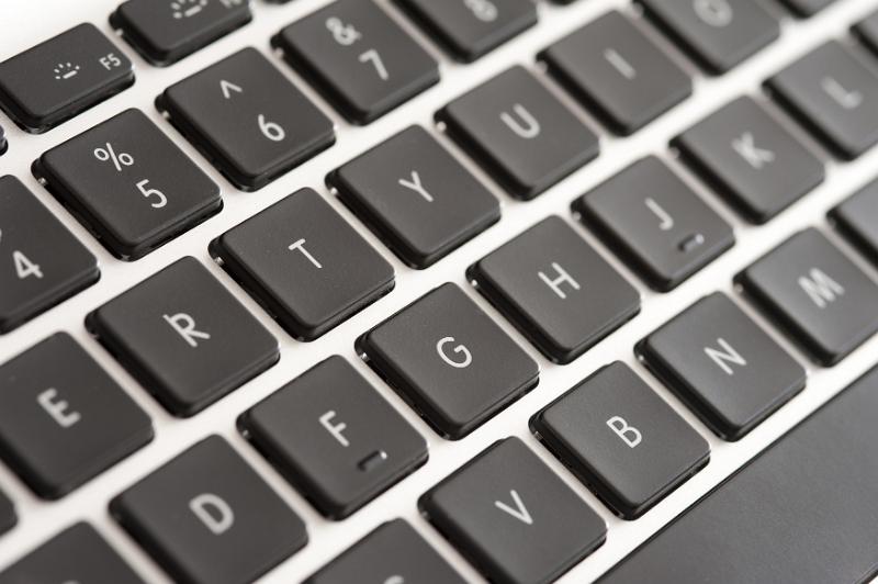 Download image of Qwerty computer keyboard Free Stock Photo: Qwerty computer keyboard with black keys in a close up view of the letters, numbers and functions