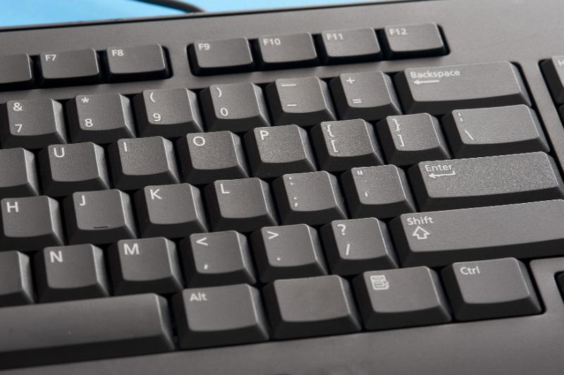 Download image of Black alphanumeric computer keyboard Free Stock Photo: Black wired alphanumeric computer keyboard viewed close up from above