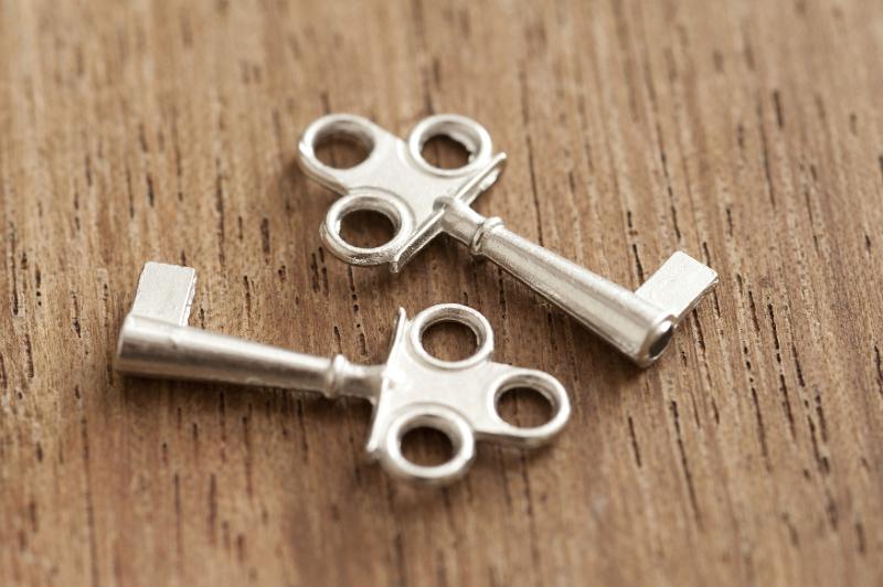 Download image of Close up Two Keys on Top of Wooden Table Free Stock Photo: Close up Conceptual Two Silver Keys Lying on Top of an Old Wooden Table