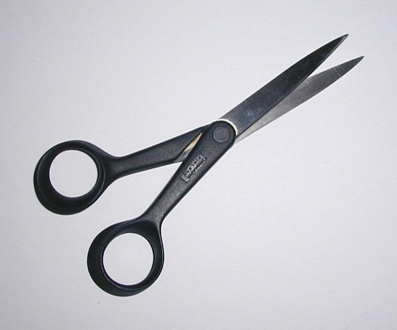Free Stock Photo: Close up view of sharp scissors with black rounded handles against a white background