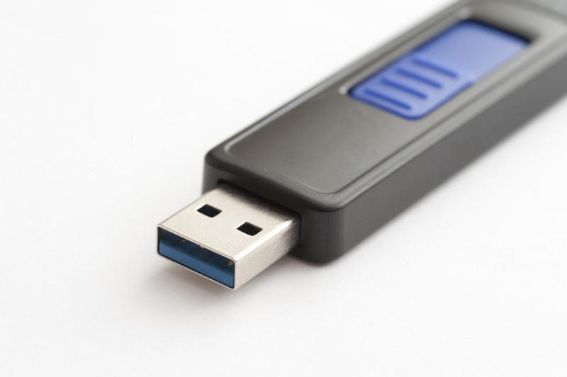Free Stock Photo: USB flash drive for data storage and computing using flash memory, close up view of the connector lying on white