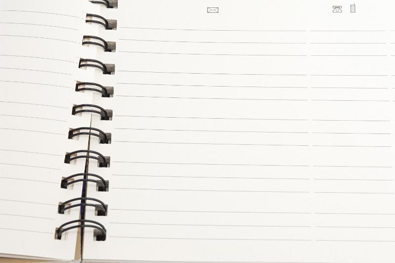 Free Stock Photo: Open blank spiral bound notebook with lined pages ready for your text or message