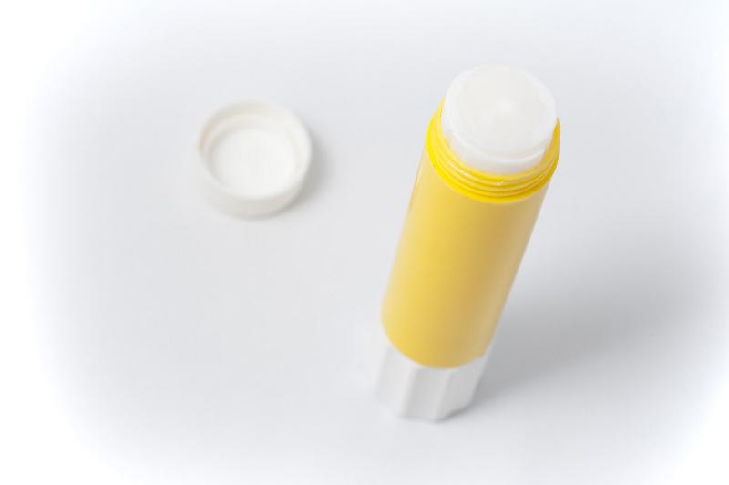 Free Stock Photo: Opened yellow glue stick on white background