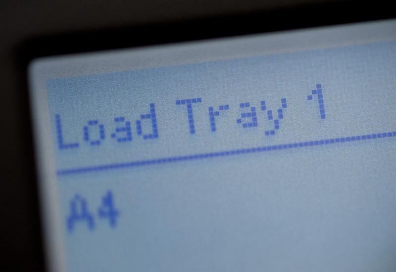 Free Stock Photo: Load Paper digital display on a photocopier requesting that the user refill the paper tray