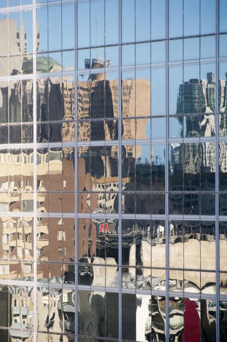 Free Stock Photo: Reflections of highrise urban buildings in a modern glass-walled office block