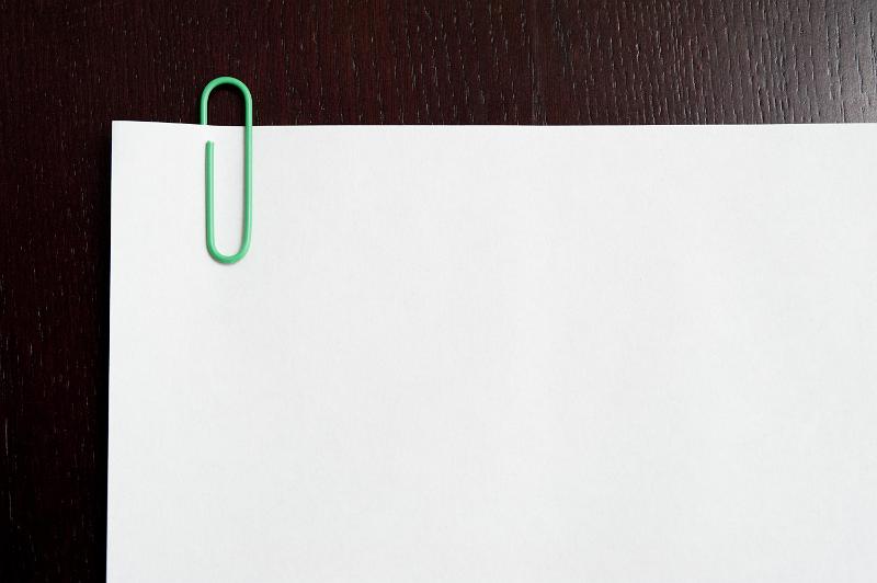 Download image of Blank paper with green paperclip on it Free Stock Photo: Blank paper with green paperclip on it - copy space