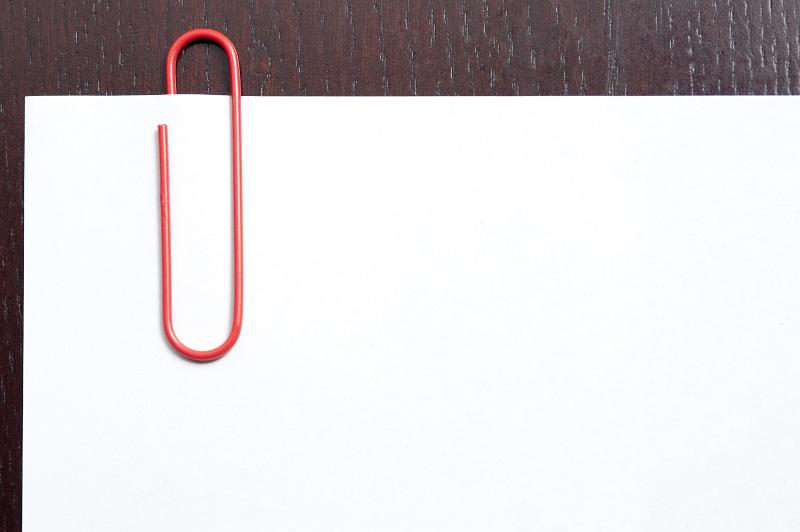 Download image of Red paperclip on blank paper Free Stock Photo: Red paperclip on blank paper with copy space