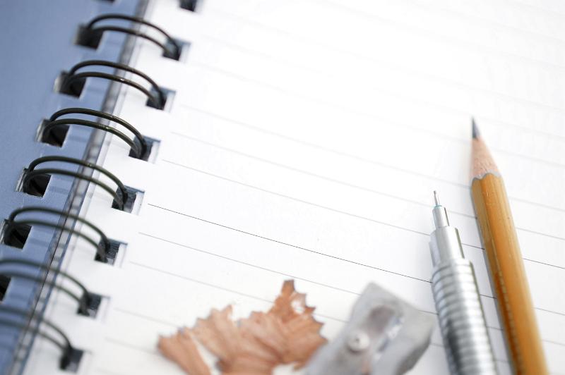 Free Stock Photo: Spiral notebook with some accutraments such as wooden pencil, mechanical pencil and a sharpener