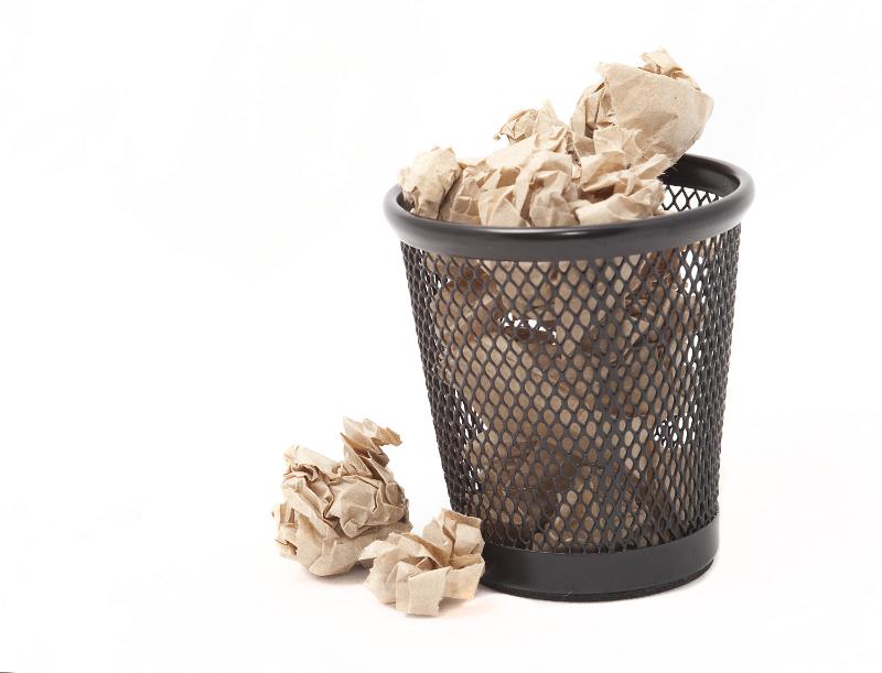 Free Stock Photo: A circular file cabinet or sometimes called a trash can getting full of waste paper