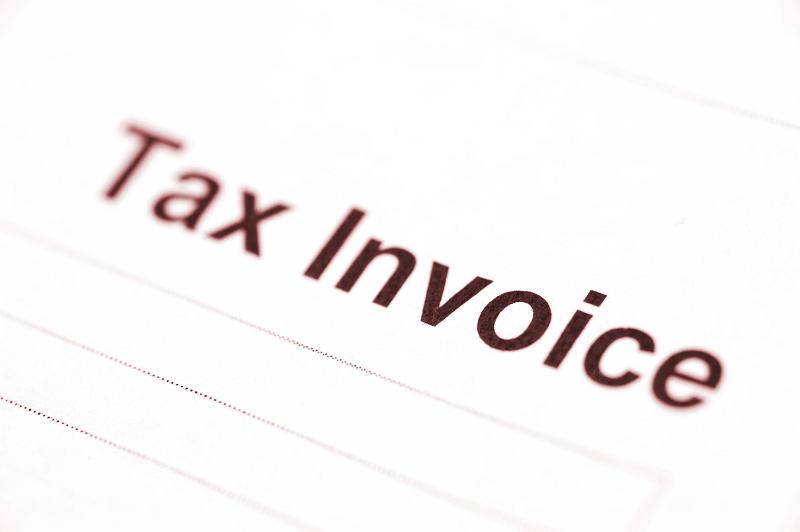 Free Stock Photo: Background of a blank white lined document with header Tax Invoice and shallow dof