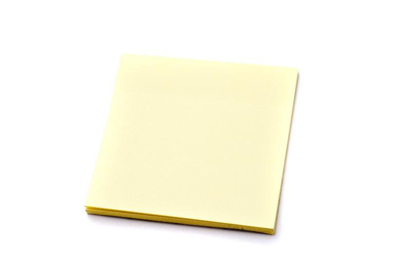 Free Stock Photo: Block of yellow paper notes on white background