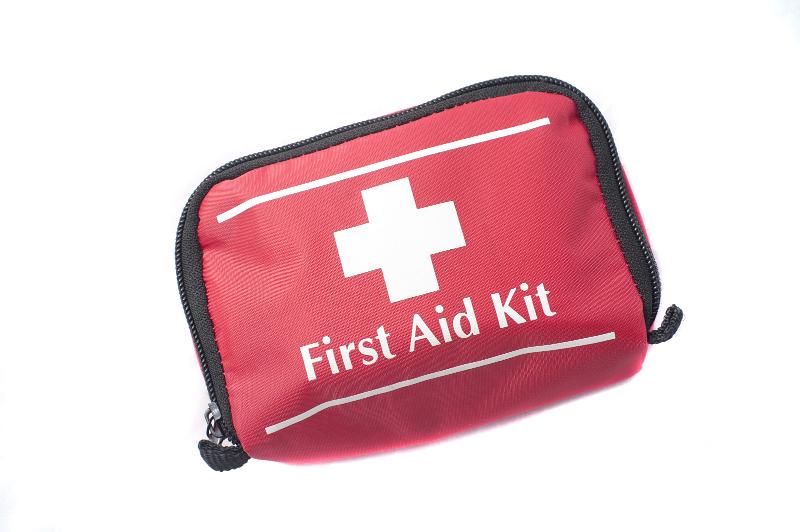 Free Stock Photo: Portable first aid kit in a red bag with a white cross used in medical emergencies for the treatment of patients in situ