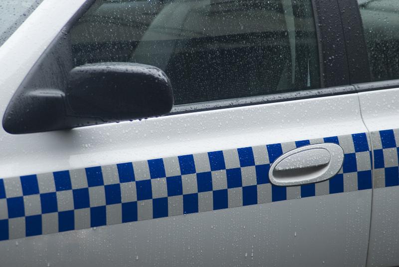 Free Stock Photo: Blue and white chequered markings on a police van used as a means of identifying vehicle used in law enforcement