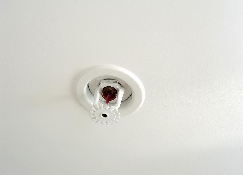 Free Stock Photo: Ceiling mounted fire sprinkler which detects the increased heat from a fire and automatically sprays jets of water on the surroundings