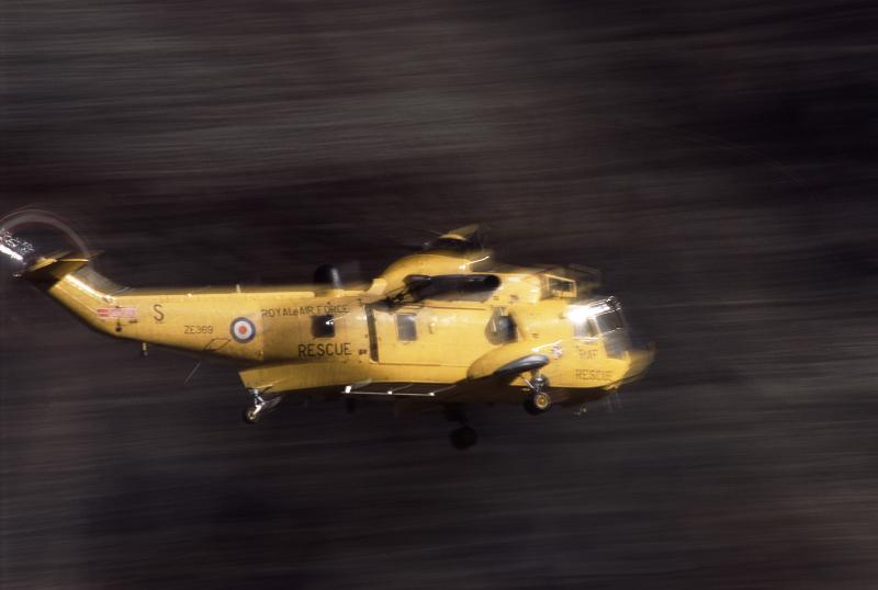 Free Stock Photo: A motion blurred yellow rescue helicopter racing to an emergency
