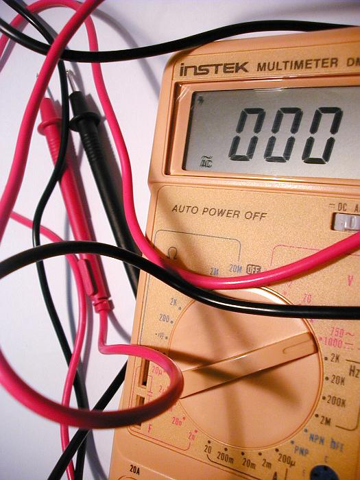 Free Stock Photo: Close Up of Multimeter Electronic Measuring Instrument with Reading of Zero, Black and Red Test Lead Wires on White Background