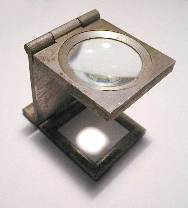 Free Stock Photo: a magnifying hand loupe for taking a close look at photos and design work