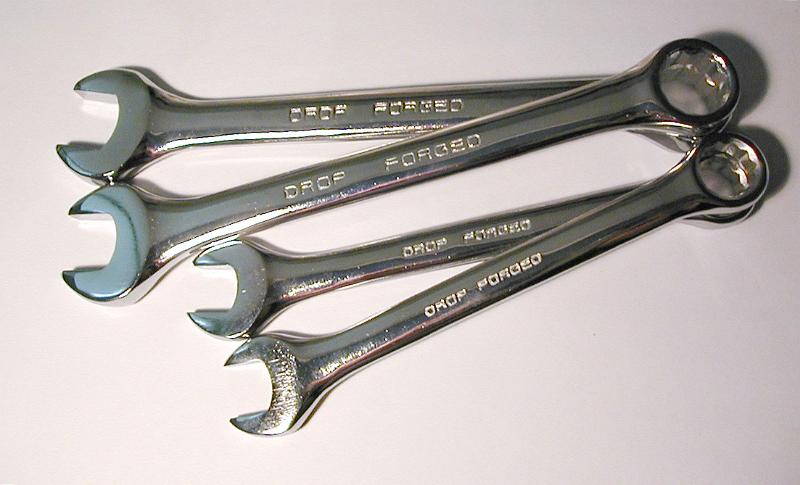 Free Stock Photo: Set of spanners or wrenches made of deep forged steel with text engraved on the handle to this effect